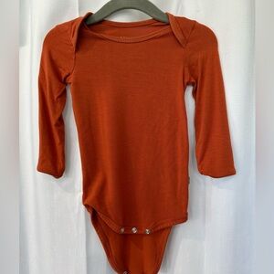 Kyte BABY Long Sleeve Bodysuit in Rust